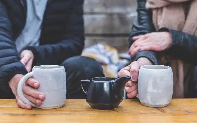 Colleagues having tea and coffee together.